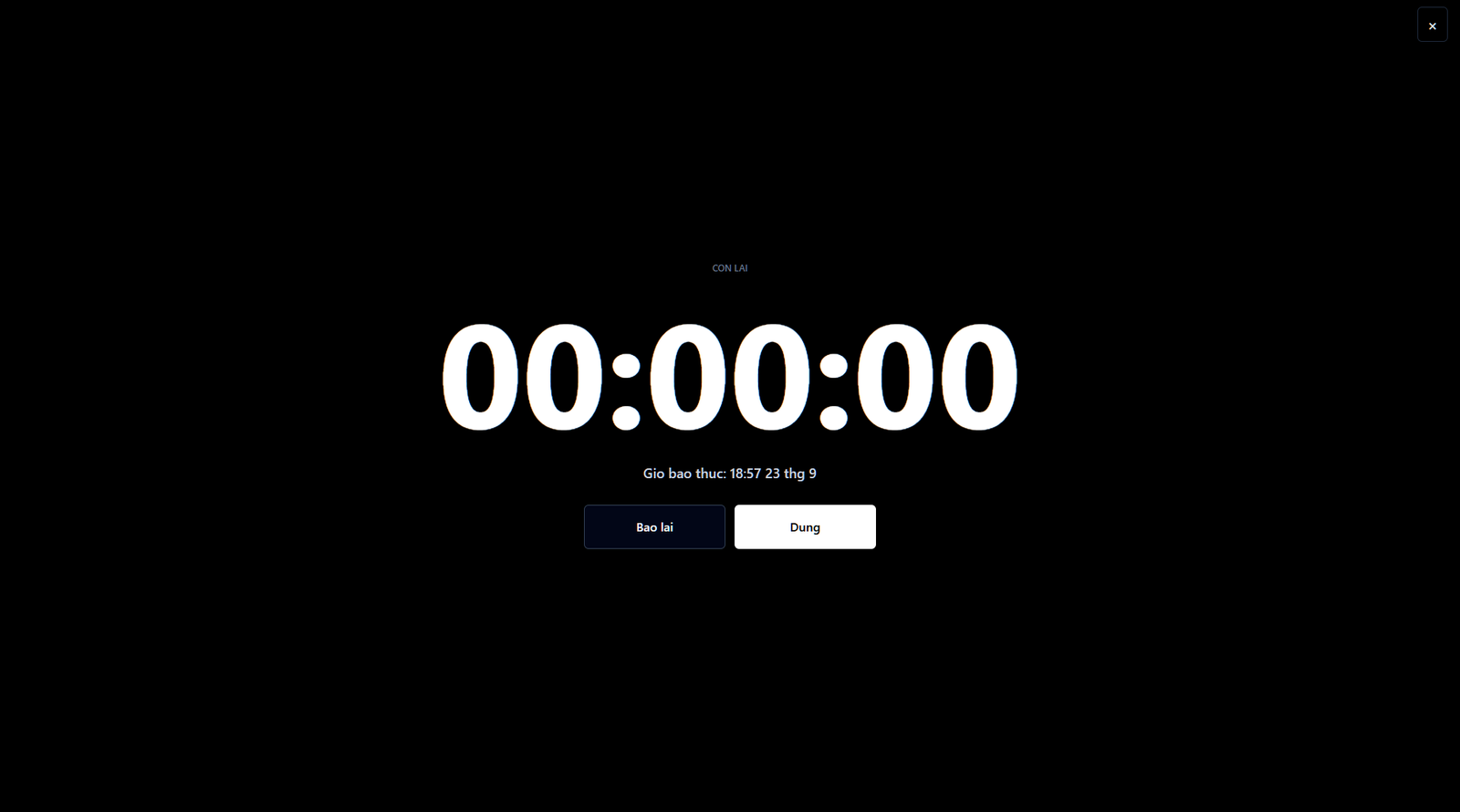 Báo thức online đang kêu trên máy tính với nút Dừng và Báo lại